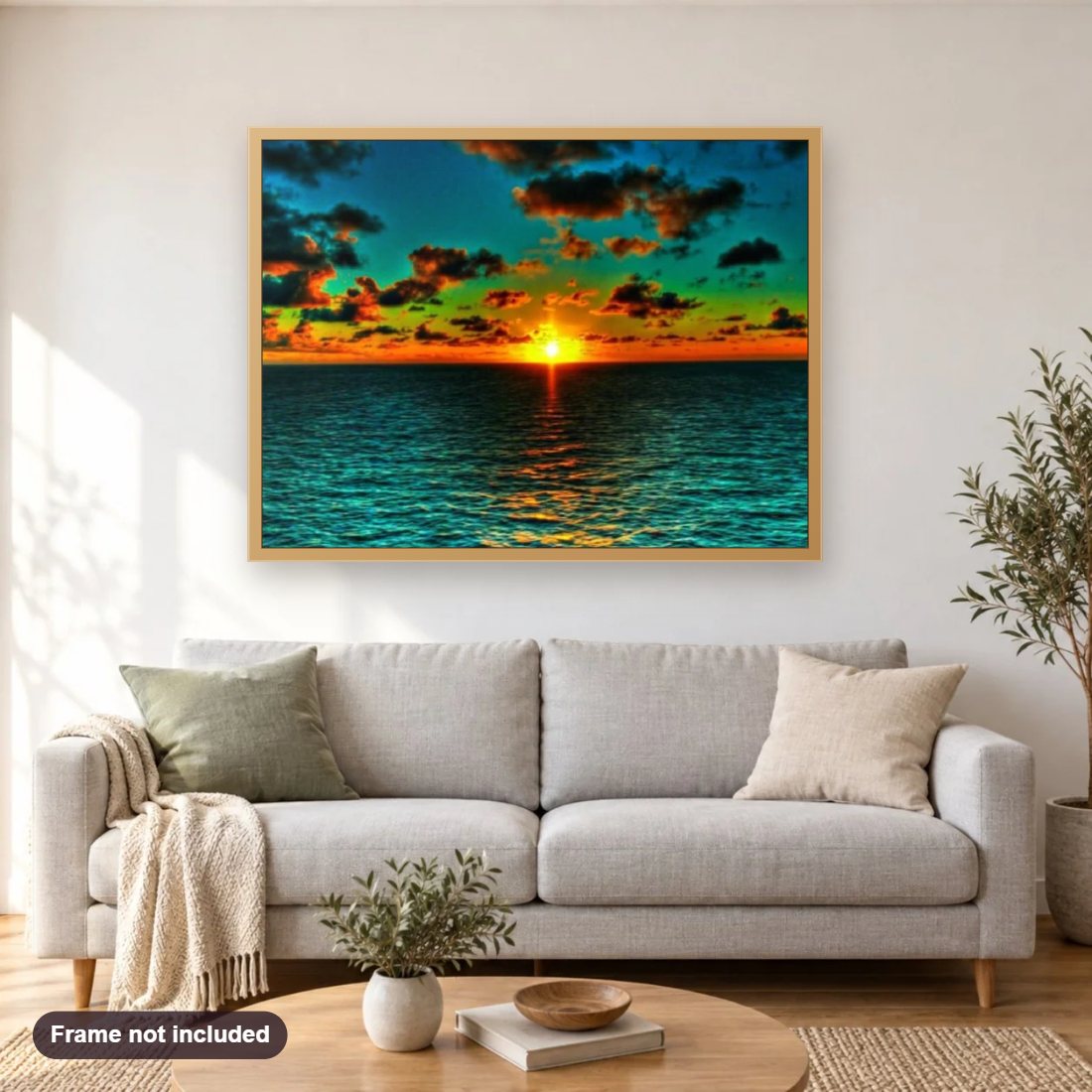 Blue Sea & Sunset diamond painting shown framed on a living room wall above a sofa