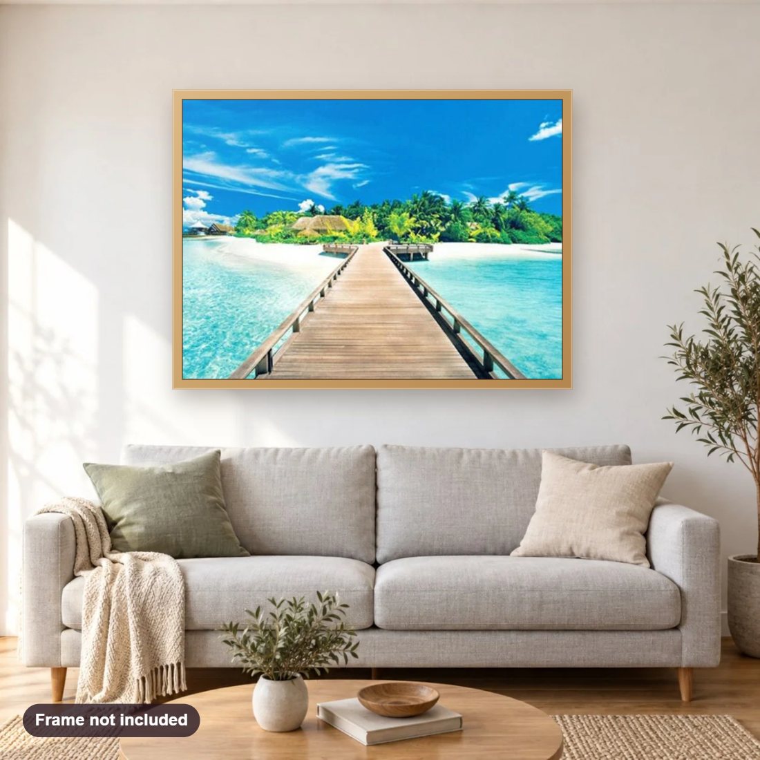 Blue Sky & Ocean diamond painting shown framed on a living room wall above a sofa