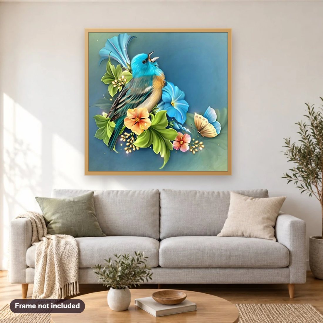 Blue Sparrow & Flowers diamond painting shown framed on a living room wall above a sofa