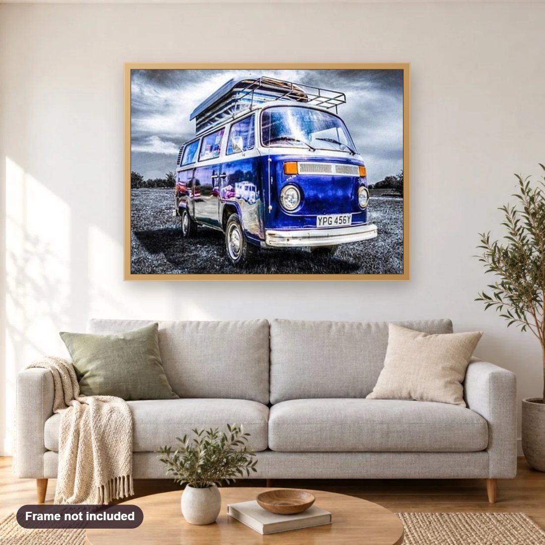 Blue Volkswagen mini bus diamond painting shown framed on a living room wall above a sofa