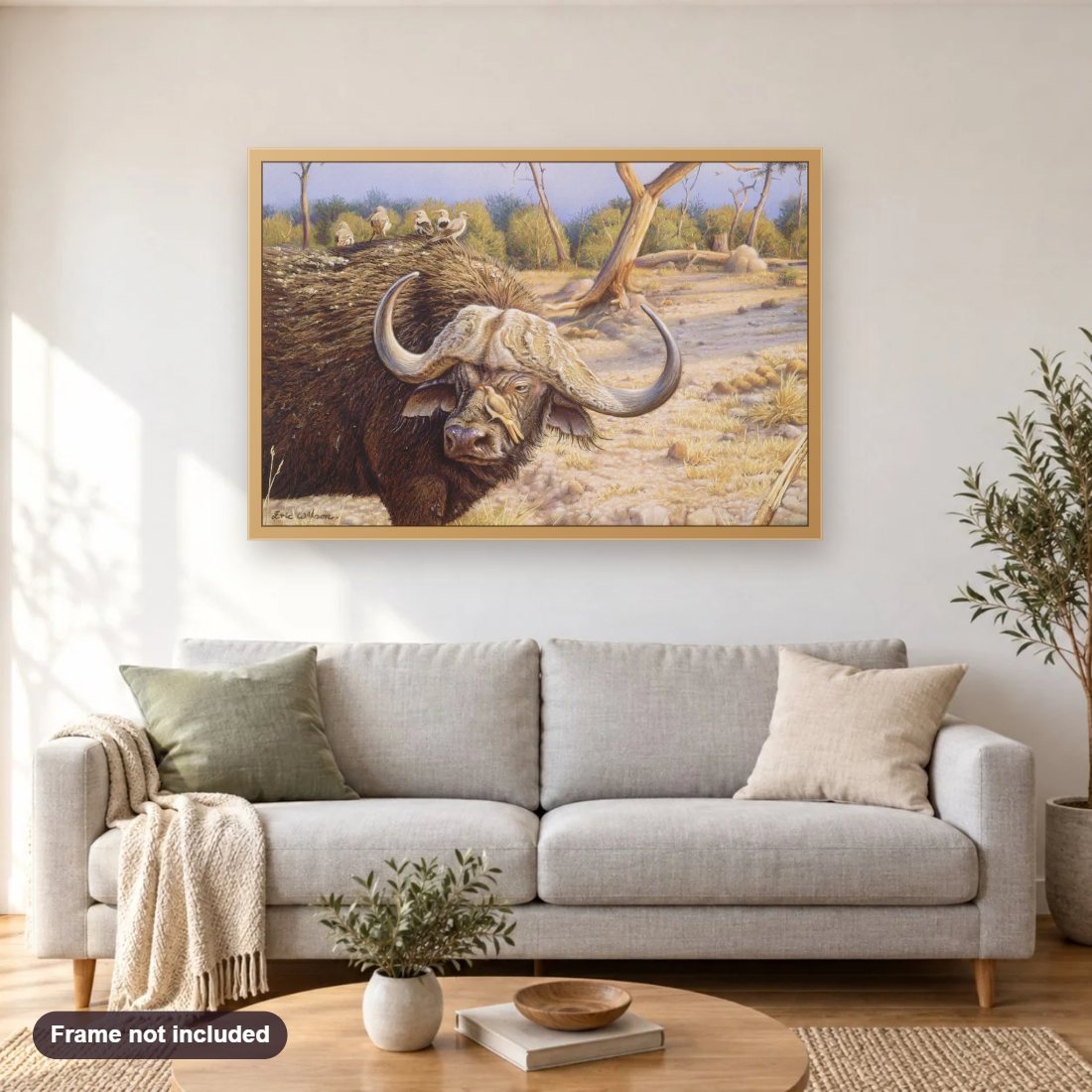 Buffalo with Ox Pecker diamond painting shown framed on a living room wall above a sofa