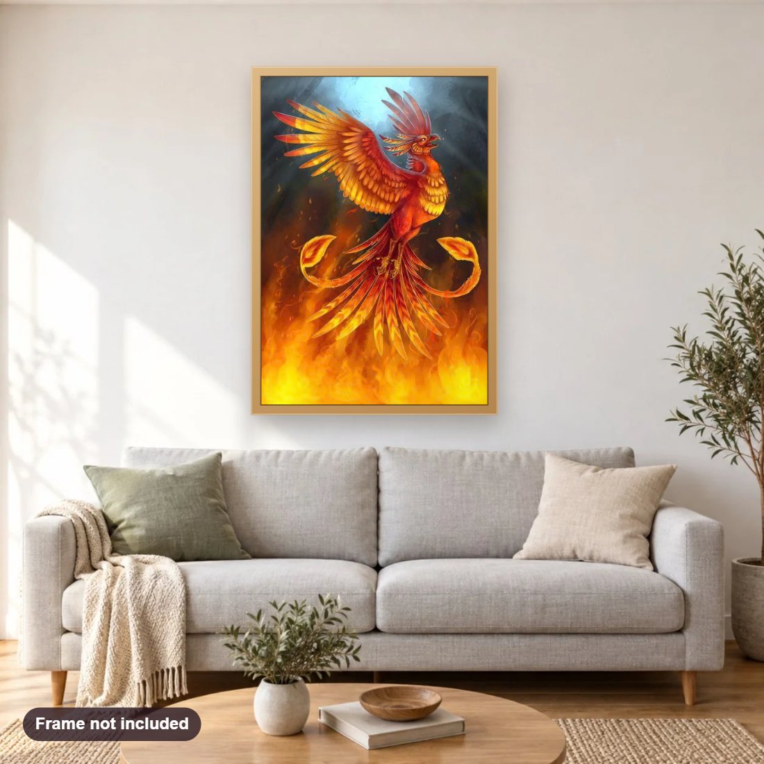 Burning Phoenix diamond painting shown framed on a living room wall above a sofa
