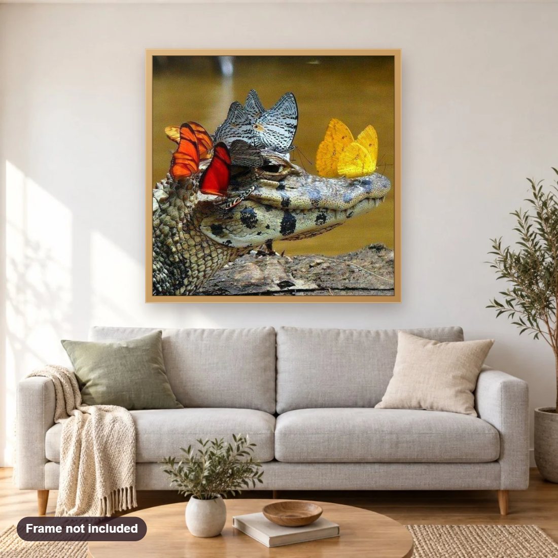 Butterflies on Crocodile diamond painting shown framed on a living room wall above a sofa