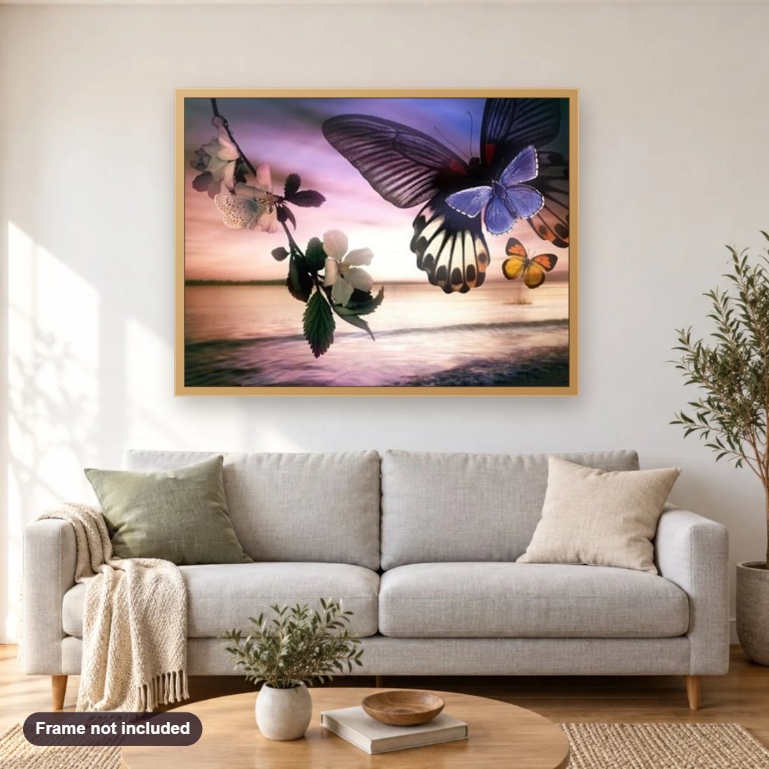 Butterflies & Landscape Beauty diamond painting shown framed on a living room wall above a sofa