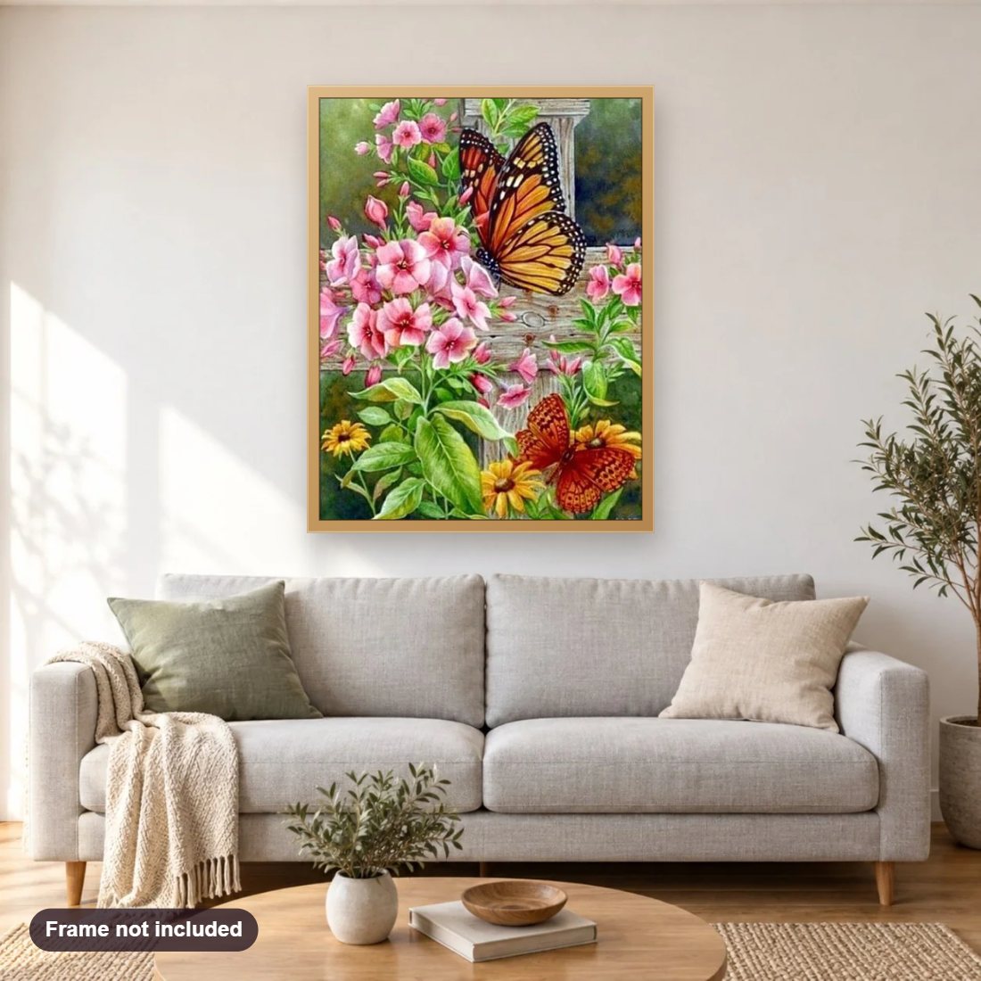 Butterflies on Flowers diamond painting shown framed on a living room wall above a sofa