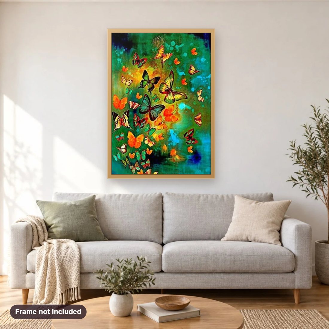 Butterfly Kingdom diamond painting shown framed on a living room wall above a sofa