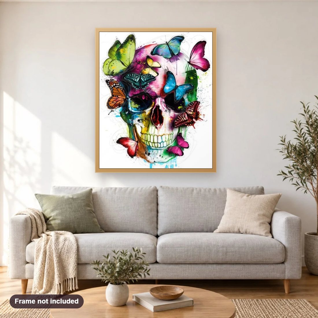Butterfly & Skull Abstract Art diamond painting shown framed on a living room wall above a sofa
