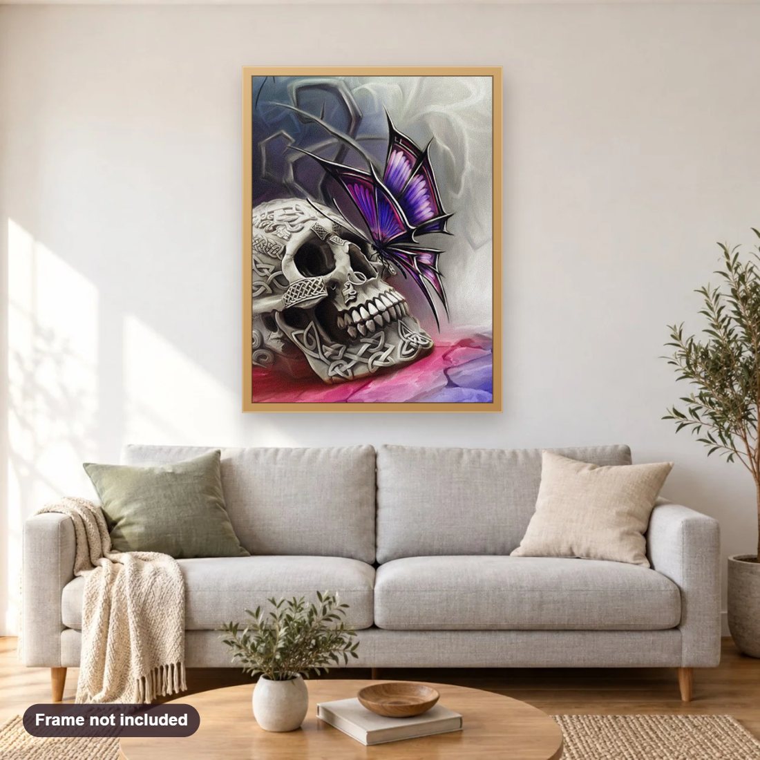 Butterfly & Skull diamond painting shown framed on a living room wall above a sofa