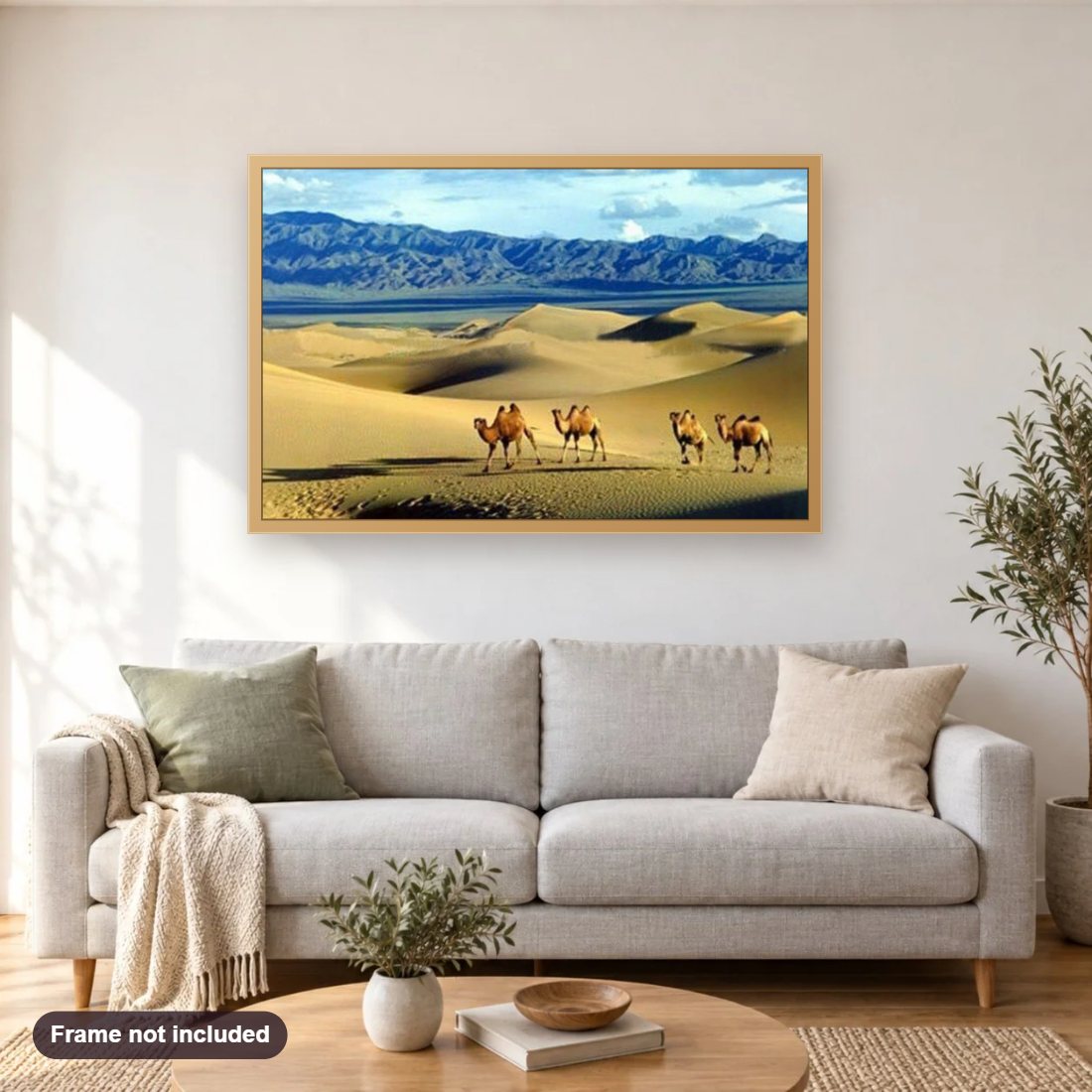 Camels in the Gobi Desert diamond painting shown framed on a living room wall above a sofa
