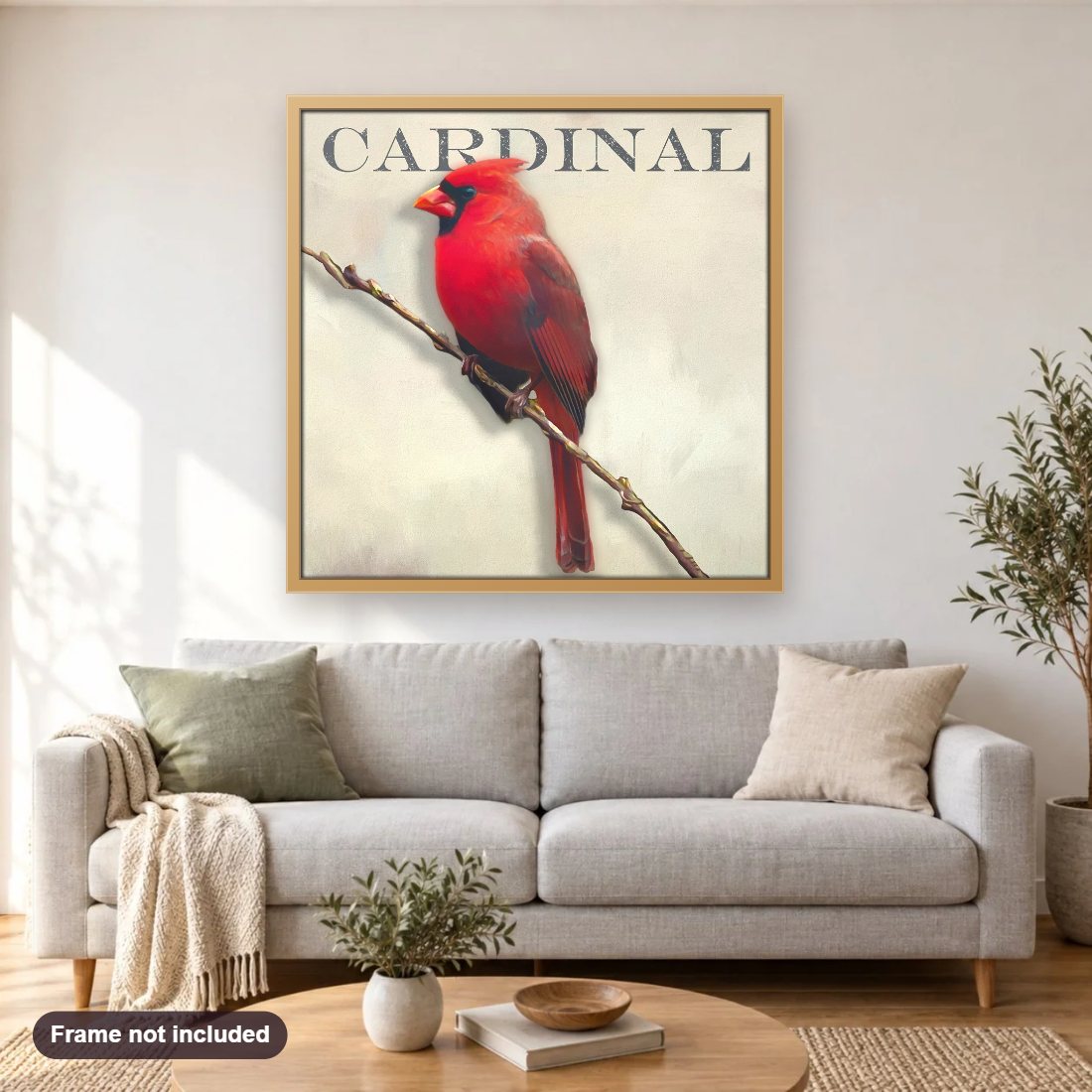 Cardinal diamond painting shown framed on a living room wall above a sofa