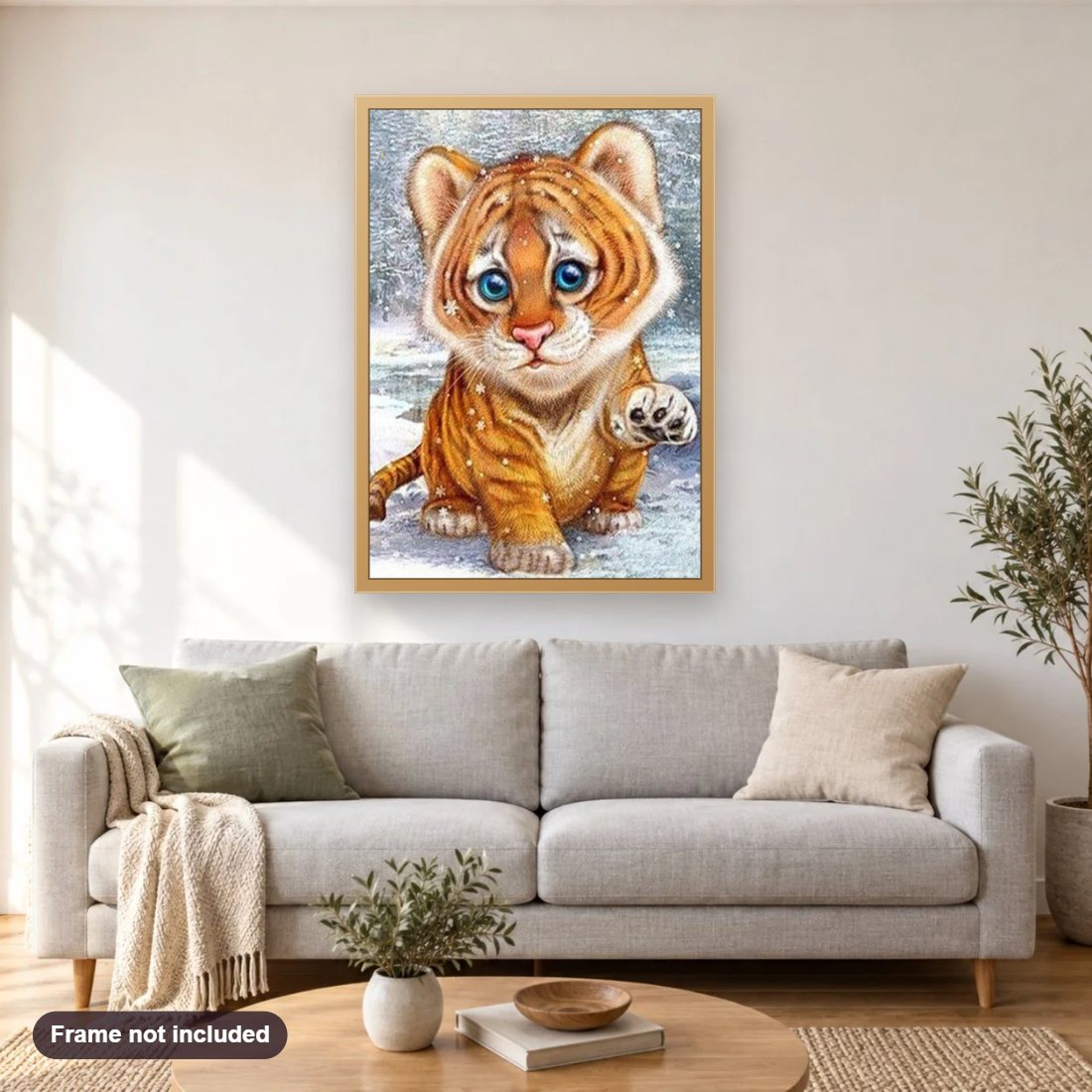 Cartoon Baby Tiger diamond painting shown framed on a living room wall above a sofa
