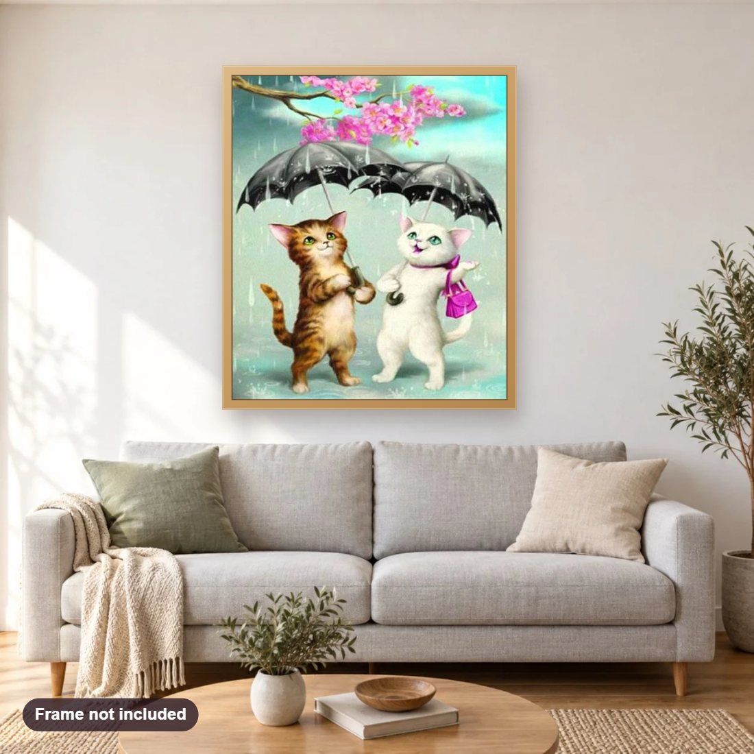 Cartoon Cats in the Rain diamond painting shown framed on a living room wall above a sofa