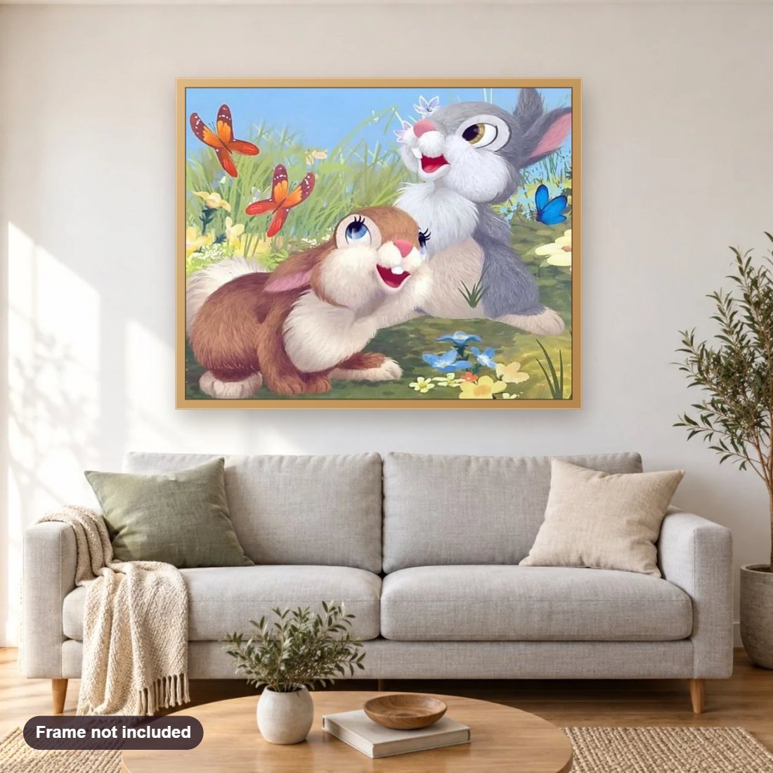Cartoon Rabbits & Butterflies diamond painting shown framed on a living room wall above a sofa