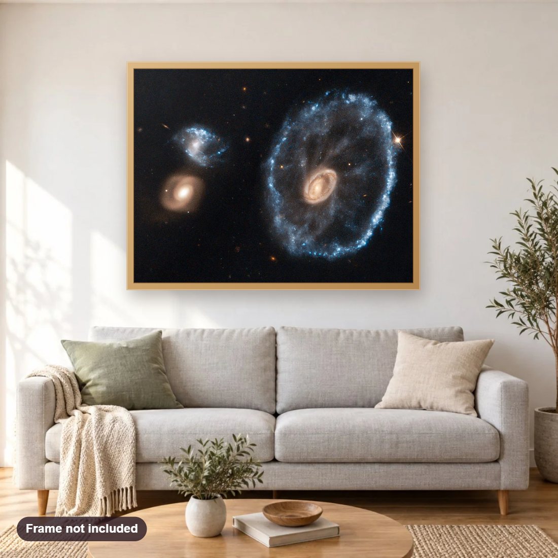 Cartwheel Galaxy diamond painting shown framed on a living room wall above a sofa