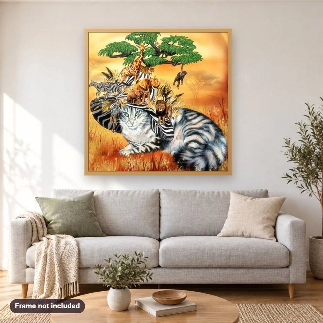Cat in a Safari Hat diamond painting shown framed on a living room wall above a sofa