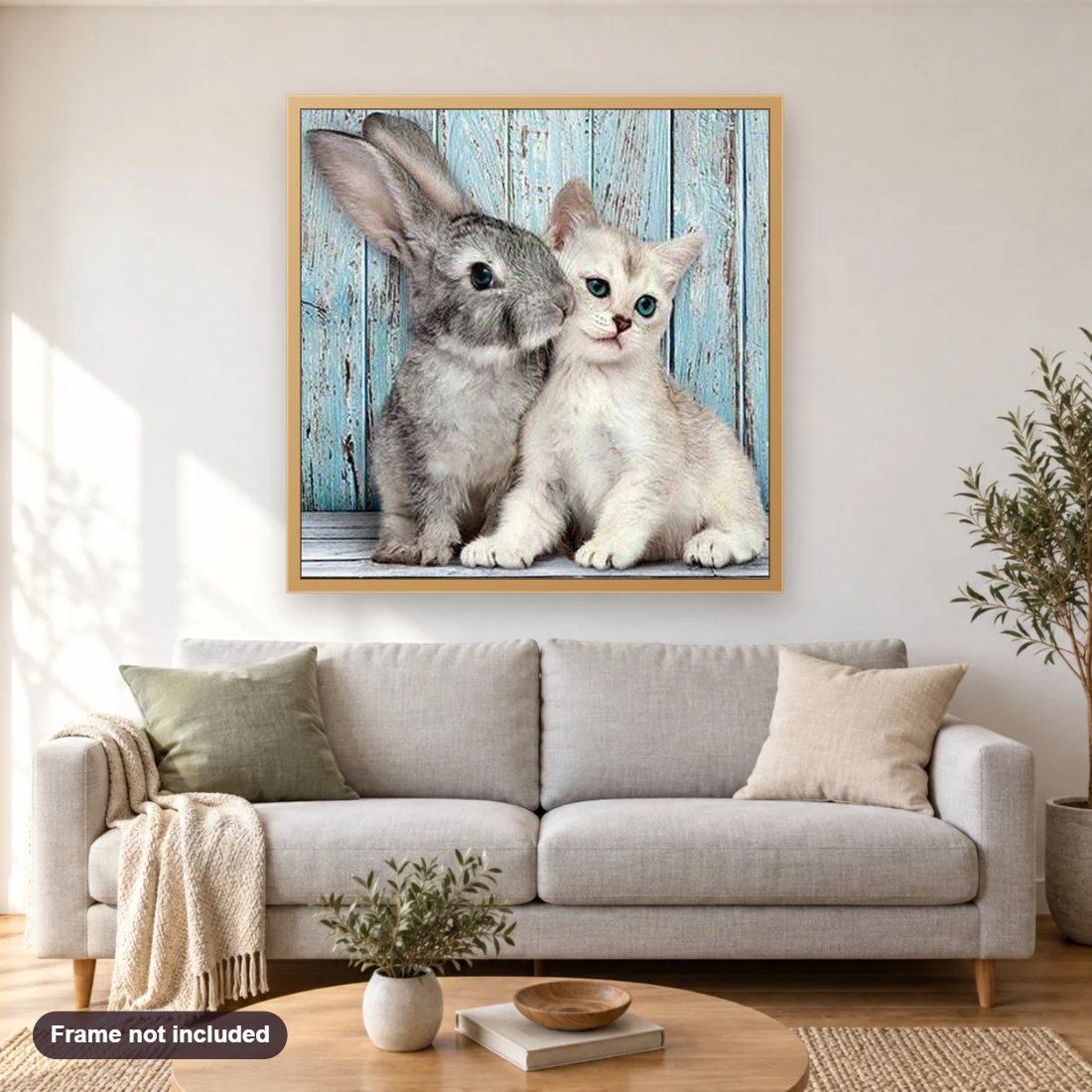 Cat & Rabbit diamond painting shown framed on a living room wall above a sofa