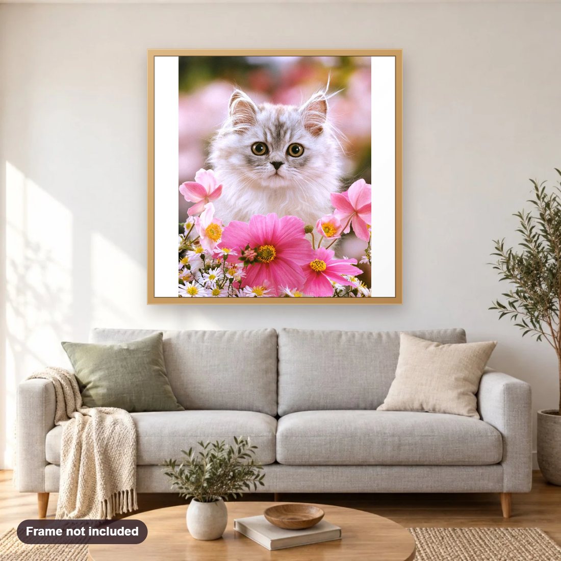Cat Sitting in Flowers diamond painting shown framed on a living room wall above a sofa