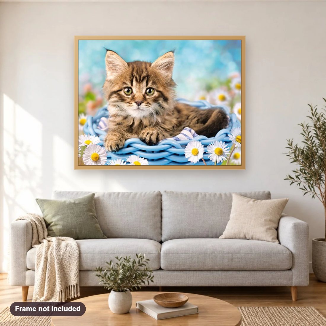 Cat & White Daisies diamond painting shown framed on a living room wall above a sofa