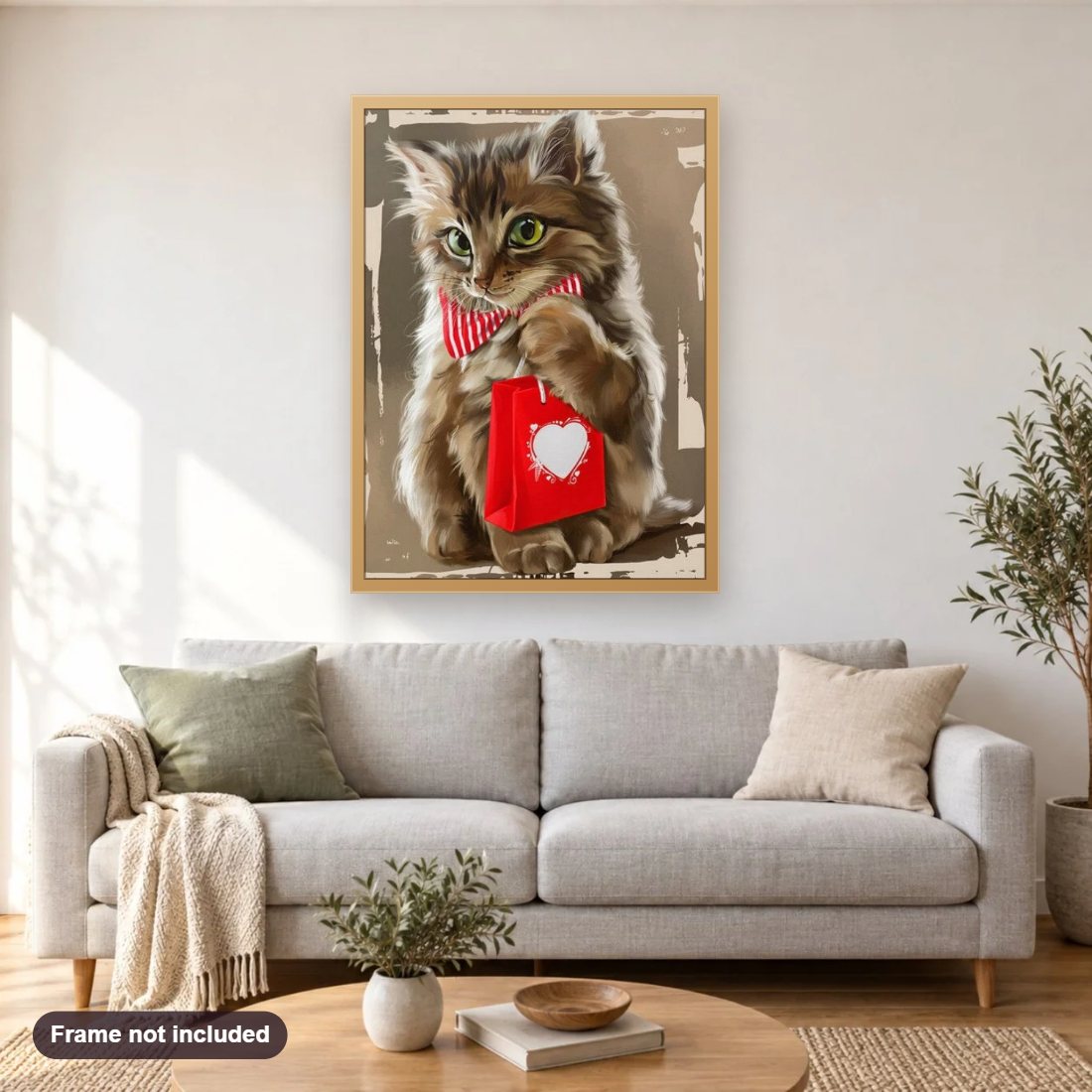 Cat with Gift diamond painting shown framed on a living room wall above a sofa