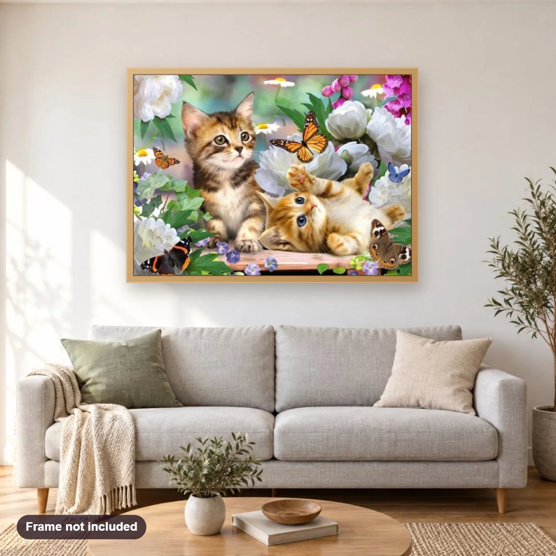 Cats & Butterflies diamond painting shown framed on a living room wall above a sofa
