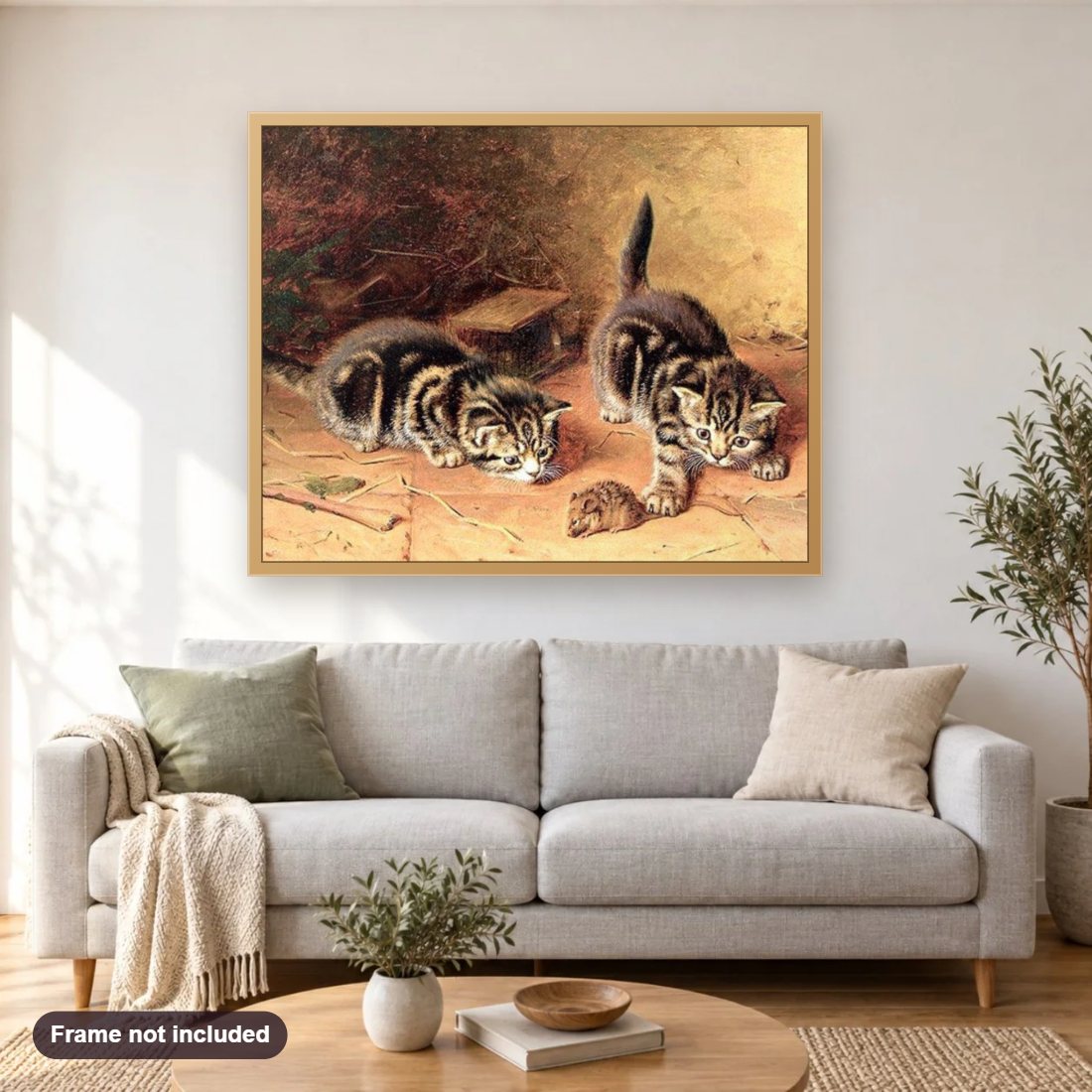 Cats Chasing Rat diamond painting shown framed on a living room wall above a sofa