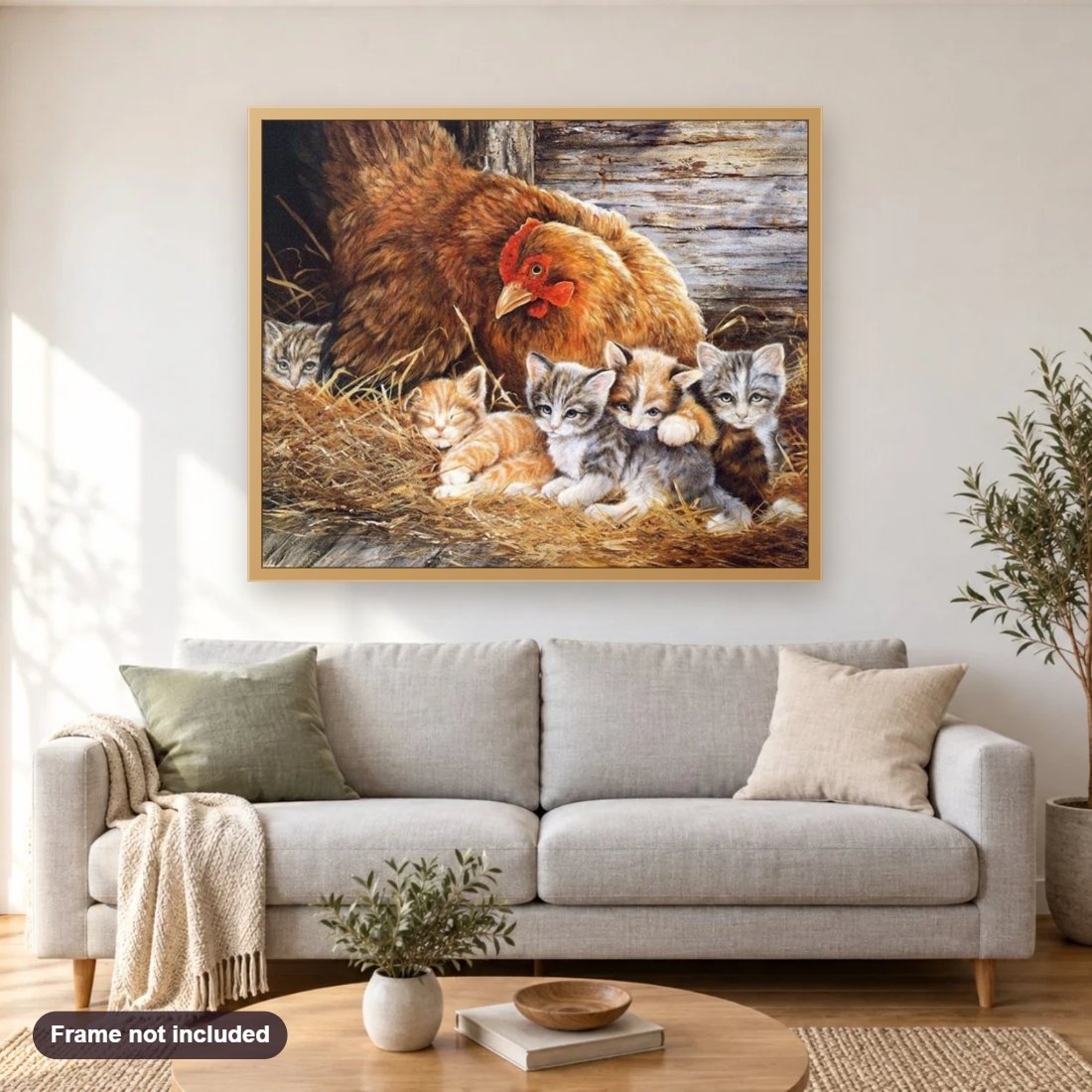 Cats & Chicken diamond painting shown framed on a living room wall above a sofa