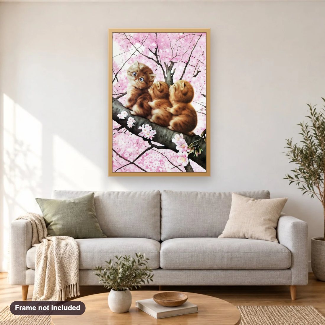 Cats on Cherry Tree diamond painting shown framed on a living room wall above a sofa