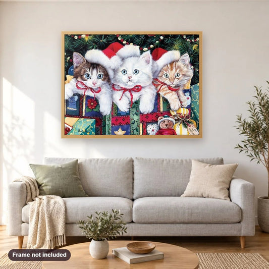 Cats on Christmas diamond painting shown framed on a living room wall above a sofa
