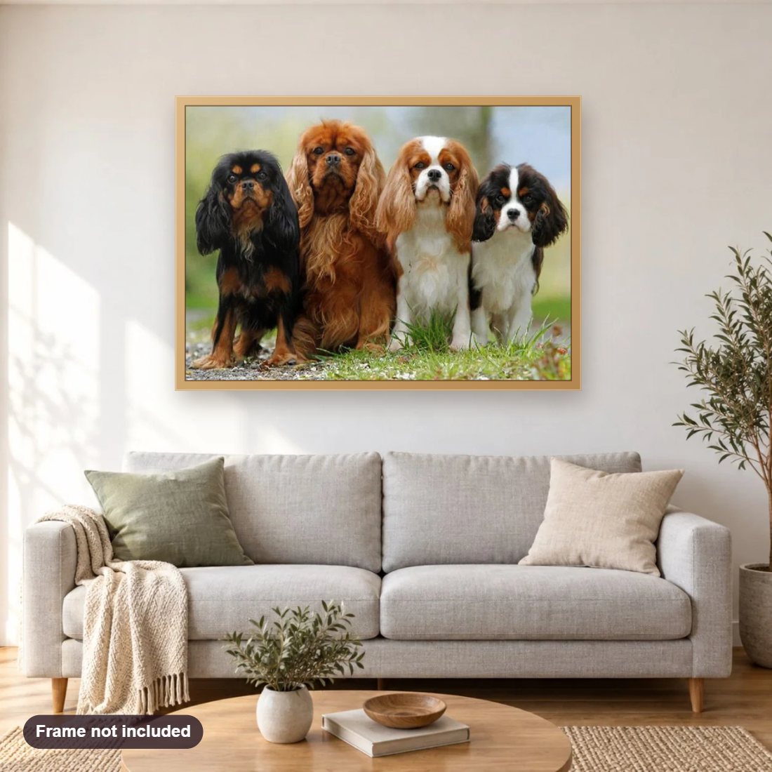 Cavalier King Charles Spaniel Puppies diamond painting shown framed on a living room wall above a sofa