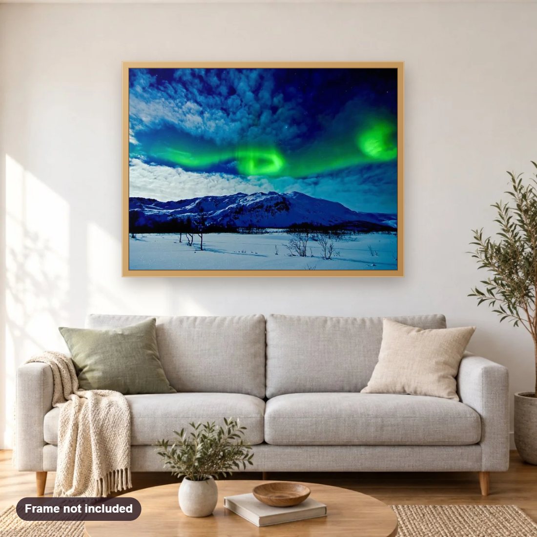 Chasing the Northern Lights in Norway diamond painting shown framed on a living room wall above a sofa