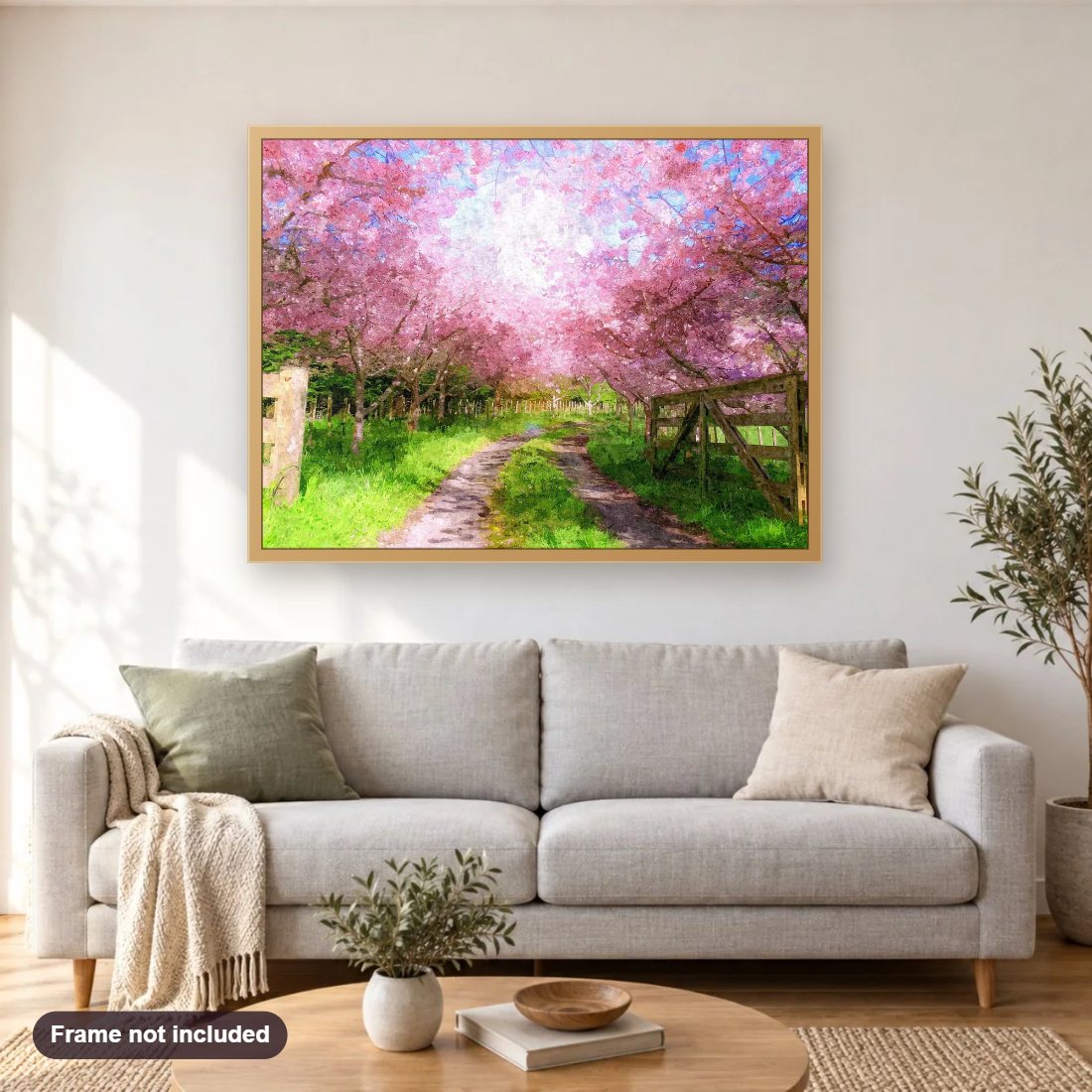 Cherry Blossom Lane diamond painting shown framed on a living room wall above a sofa