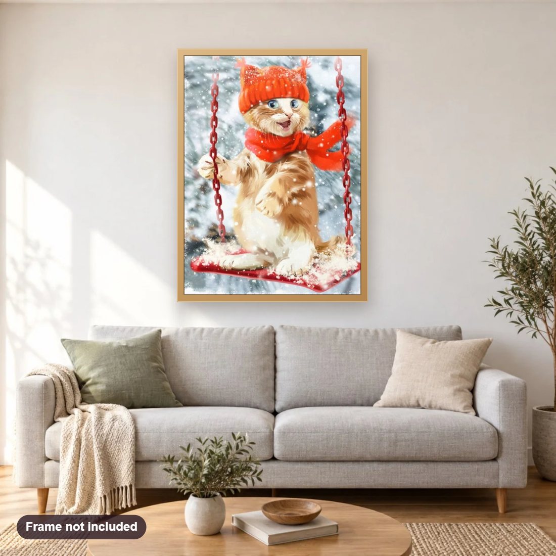 Christmas Cat on Swing diamond painting shown framed on a living room wall above a sofa