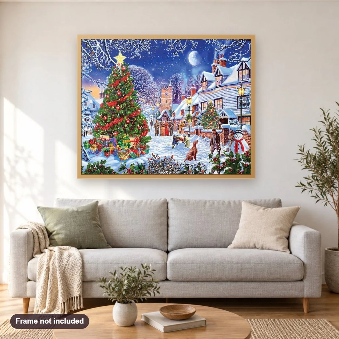 Christmas diamond painting shown framed on a living room wall above a sofa