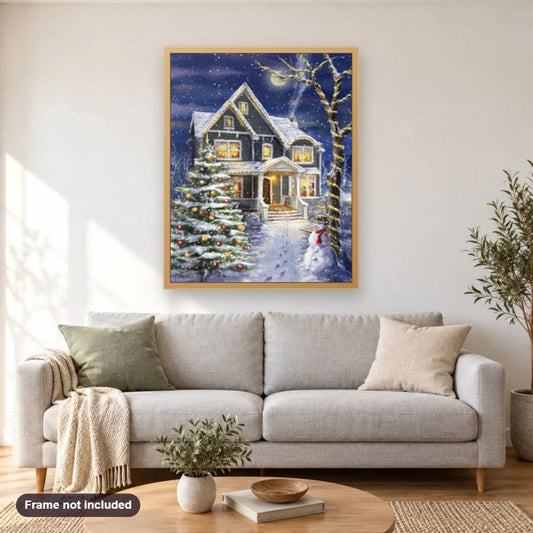 Christmas House diamond painting shown framed on a living room wall above a sofa