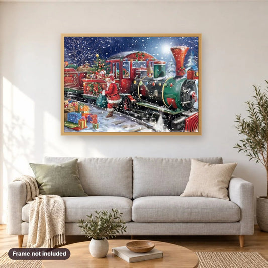 Christmas Train diamond painting shown framed on a living room wall above a sofa
