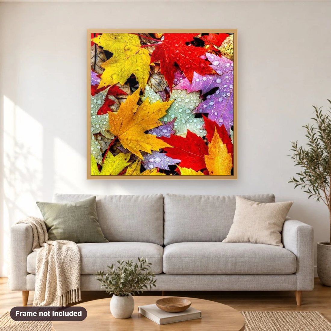 Colorful Leaves diamond painting shown framed on a living room wall above a sofa