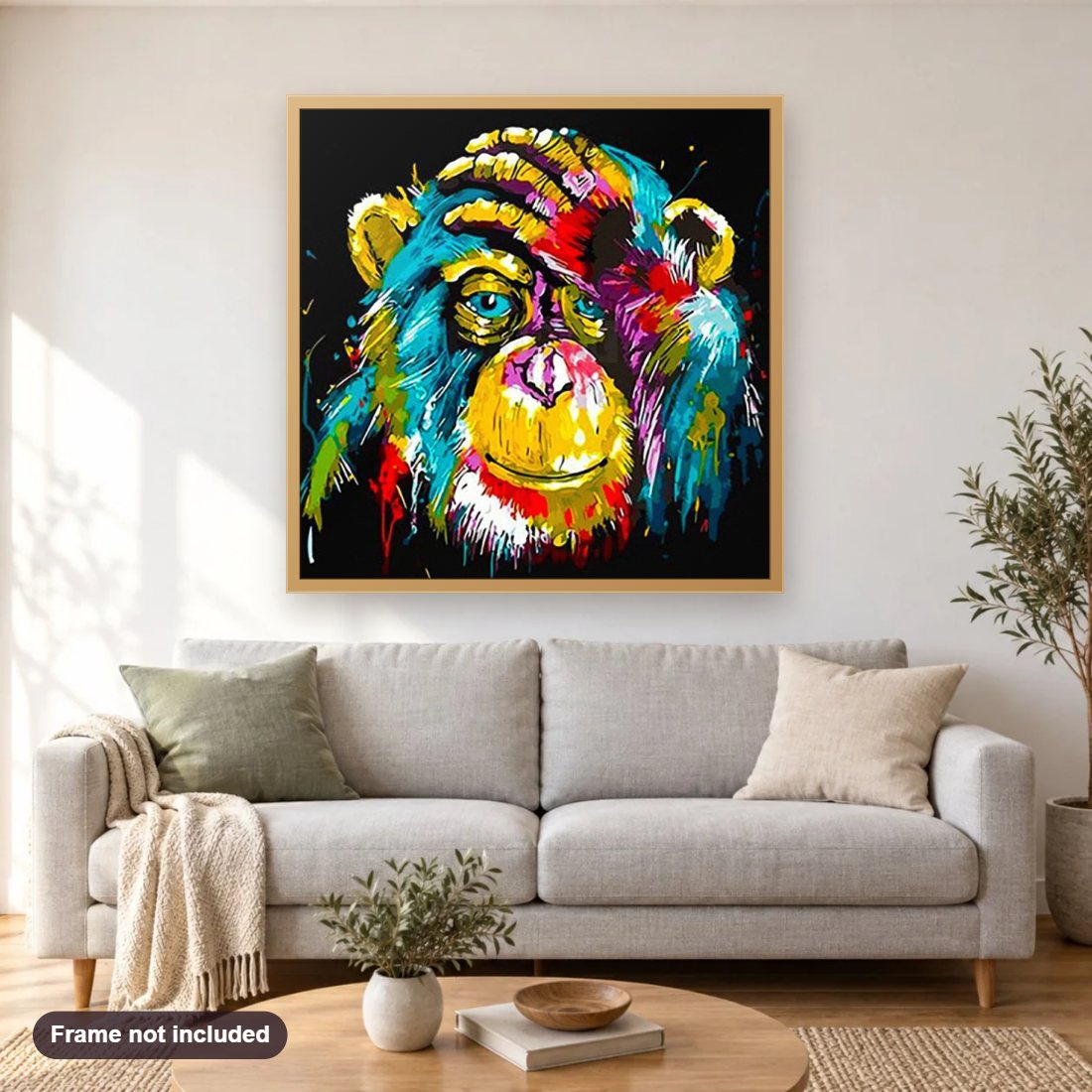 Colorful Monkey diamond painting shown framed on a living room wall above a sofa