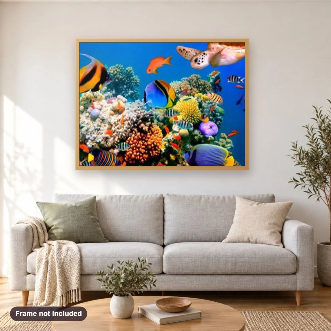 Coral Fishes of Malaysia diamond painting shown framed on a living room wall above a sofa