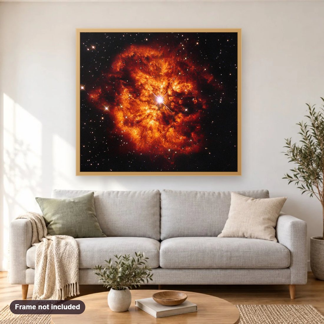 Cosmic Couple diamond painting shown framed on a living room wall above a sofa
