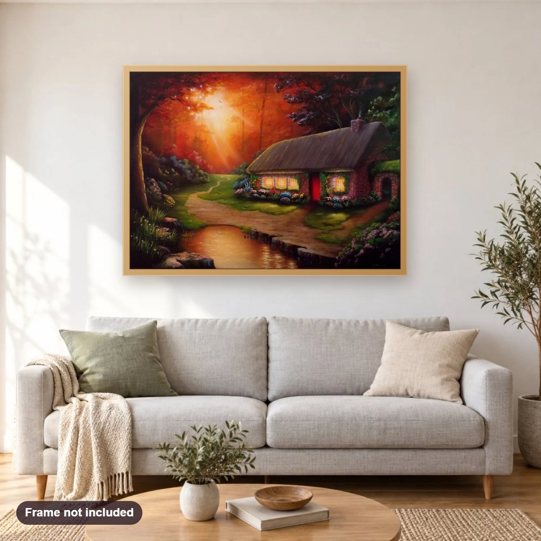 Cottage On Golden Pond diamond painting shown framed on a living room wall above a sofa