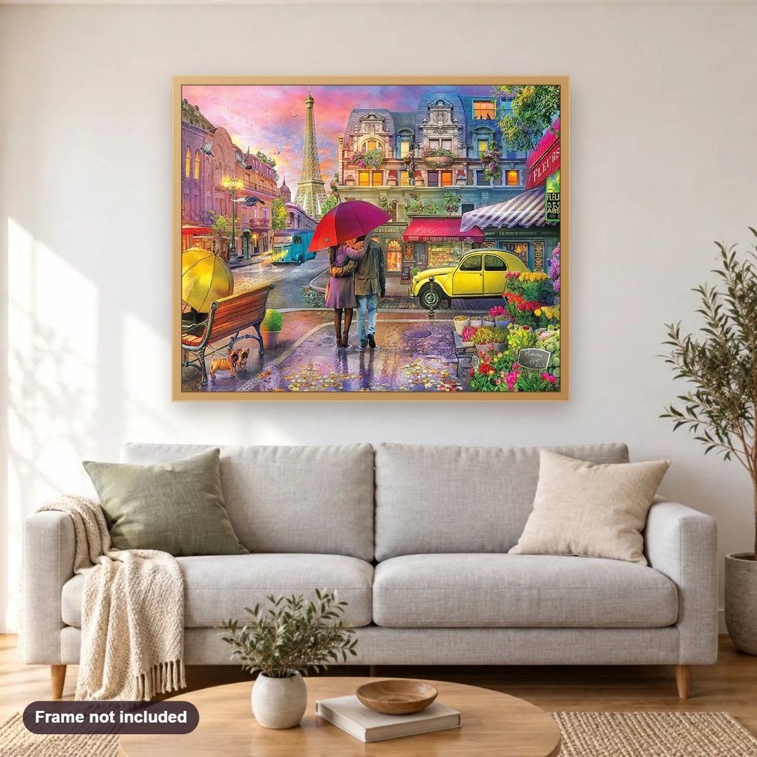 Couple on Paris Streets diamond painting shown framed on a living room wall above a sofa