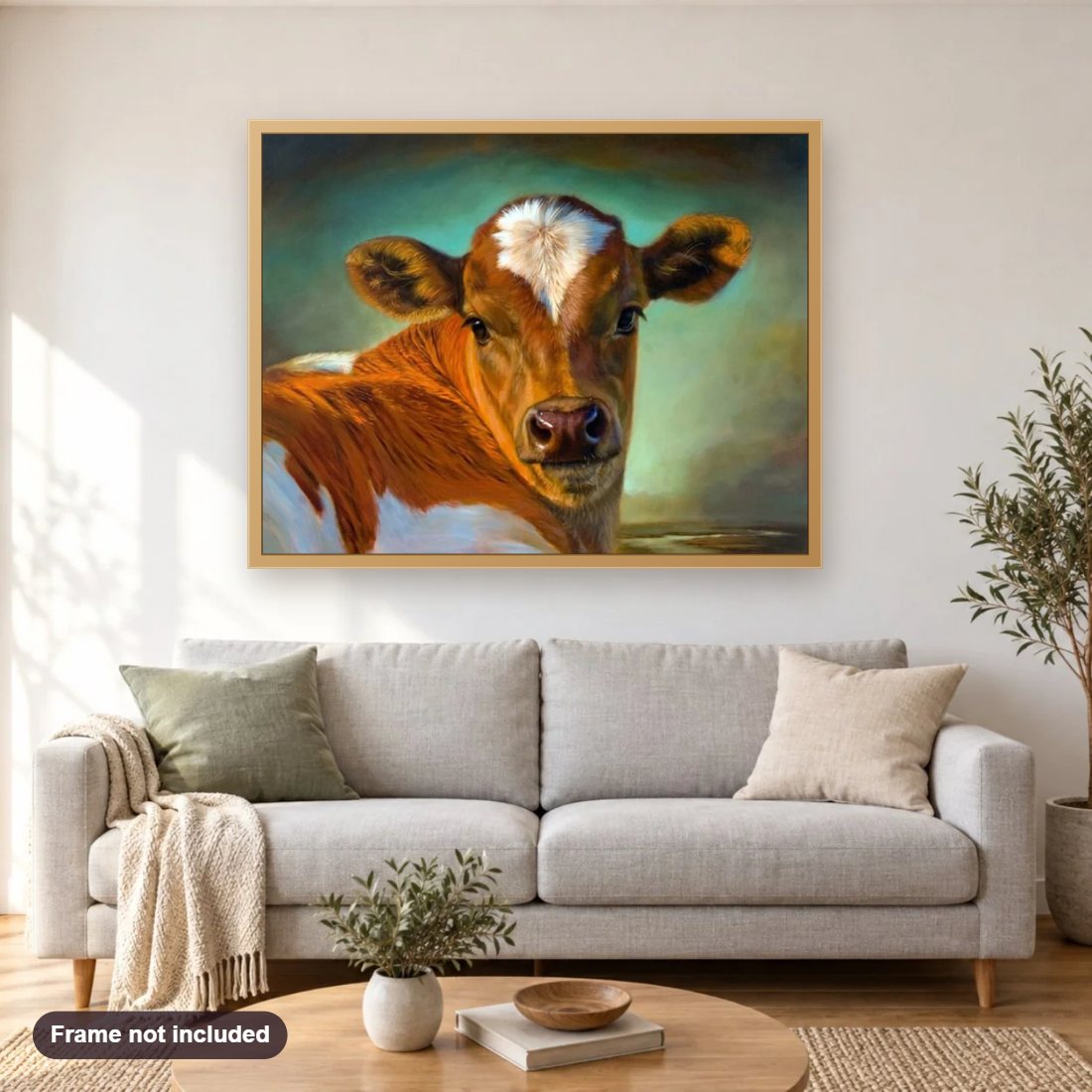 Cow diamond painting shown framed on a living room wall above a sofa