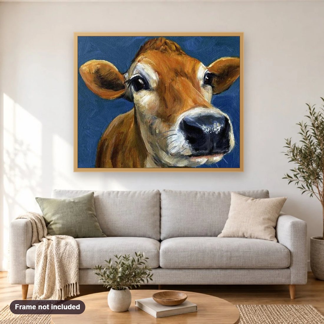 Cow Face Close up diamond painting shown framed on a living room wall above a sofa