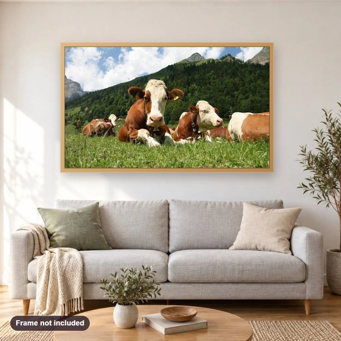 Cows in the Pasture diamond painting shown framed on a living room wall above a sofa