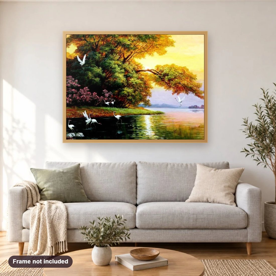 Cranes in the Lake diamond painting shown framed on a living room wall above a sofa