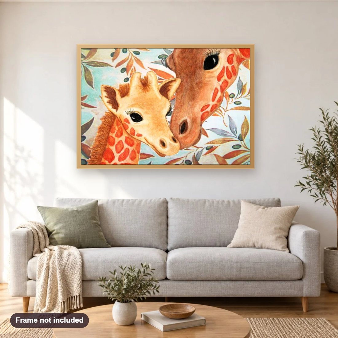 Cute Baby Giraffe & Mother diamond painting shown framed on a living room wall above a sofa