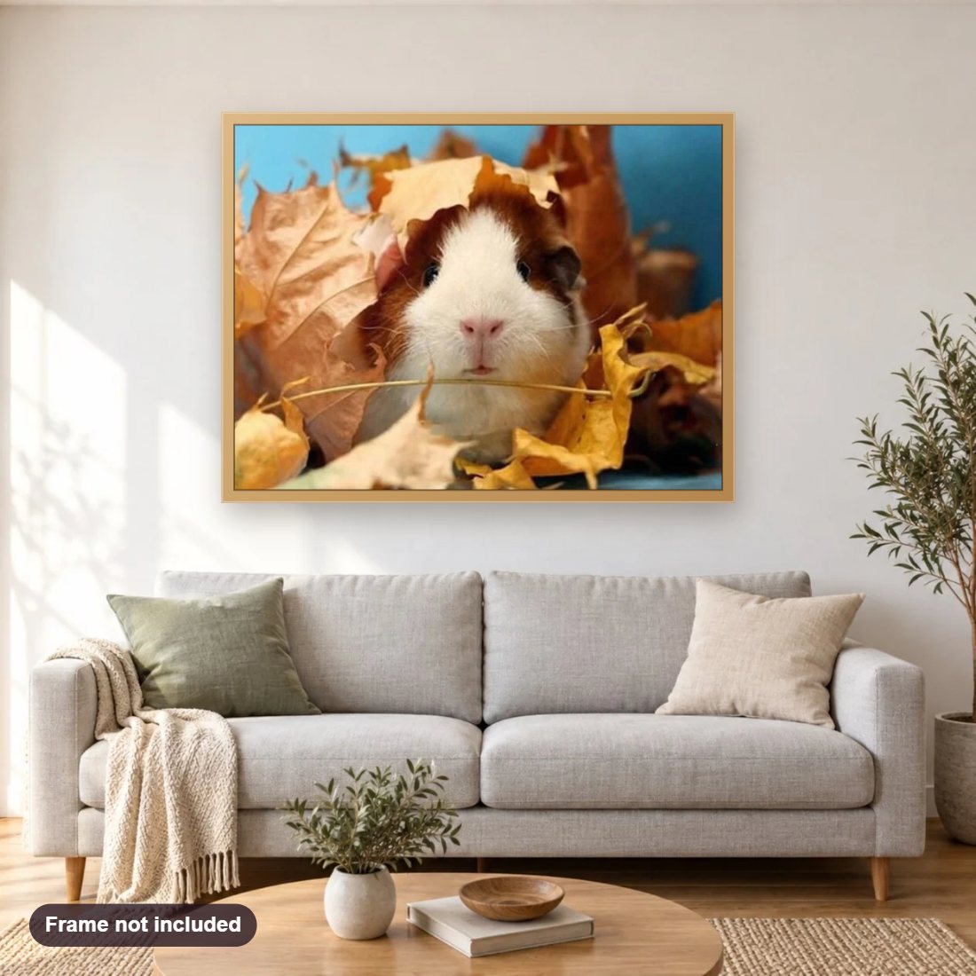 Cute Guinea pig & Autumn Leaves diamond painting shown framed on a living room wall above a sofa