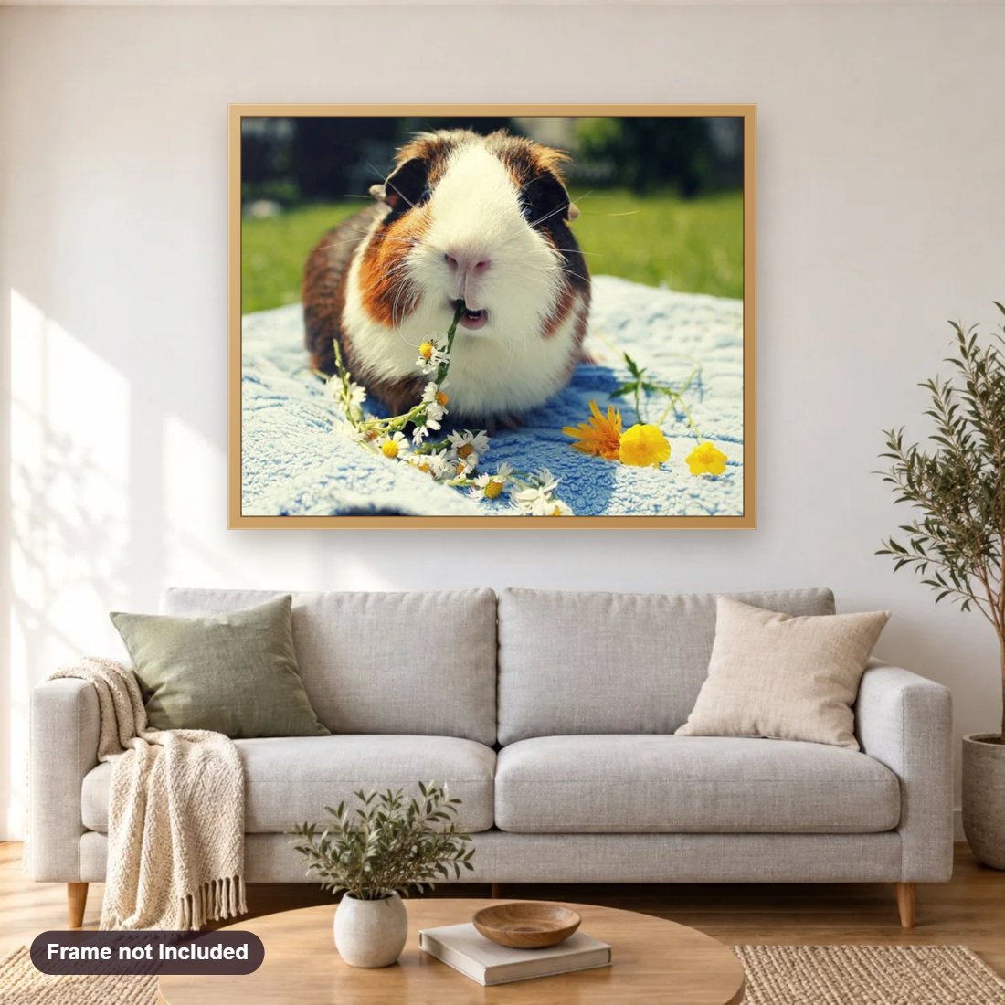 Cute Guinea Pig Eating Flowers diamond painting shown framed on a living room wall above a sofa