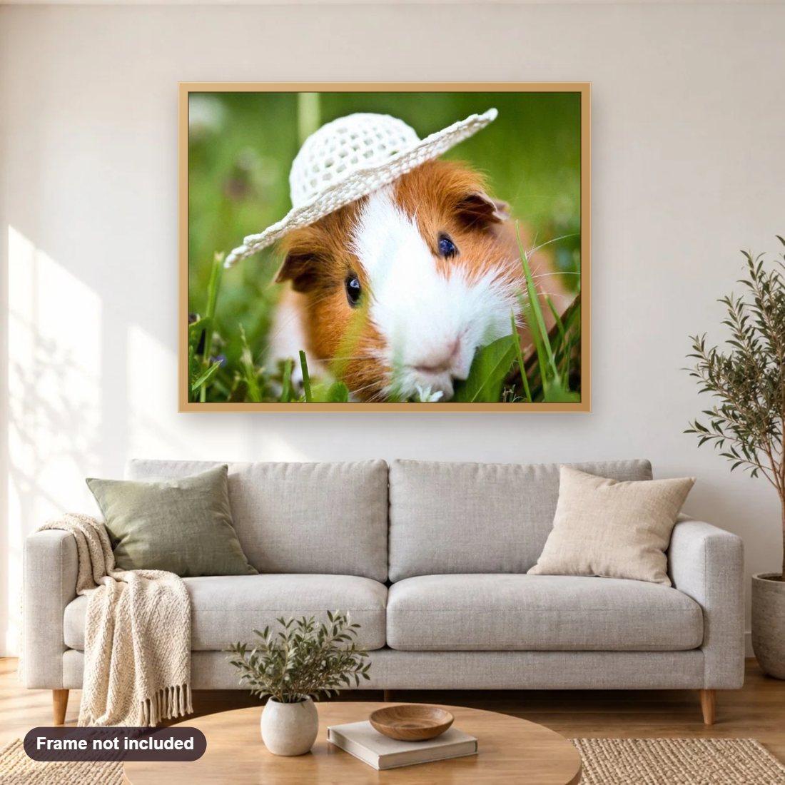 Cute Guinea Pig in Hat diamond painting shown framed on a living room wall above a sofa