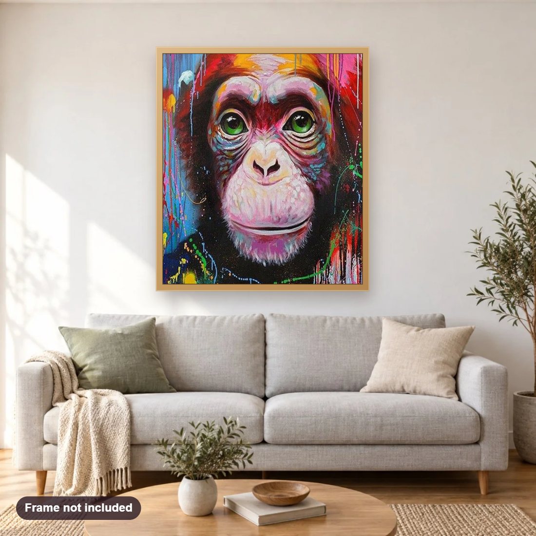 Cute Monkey with Green Eyes diamond painting shown framed on a living room wall above a sofa